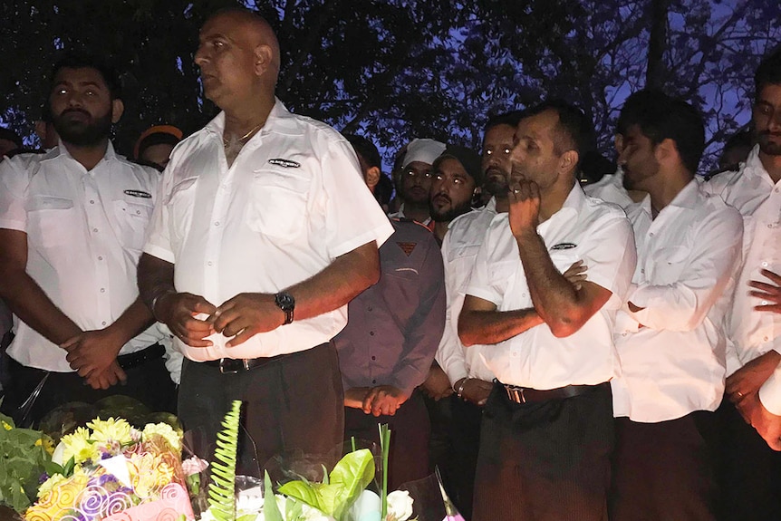 Taxi drivers at a vigil honouring Brisbane City Council bus driver Manmeet Alisher