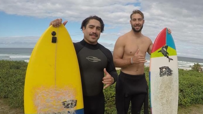 Rye Hunt and Mitchell Sheppard holding surfboards