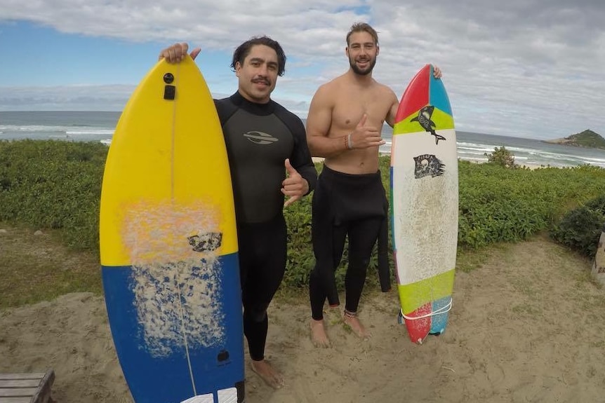 Rye Hunt and Mitchell Sheppard holding surfboards