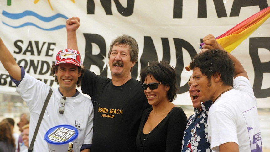 Actor Michael Caton [centre] at a Bondi train protest in Bondi.