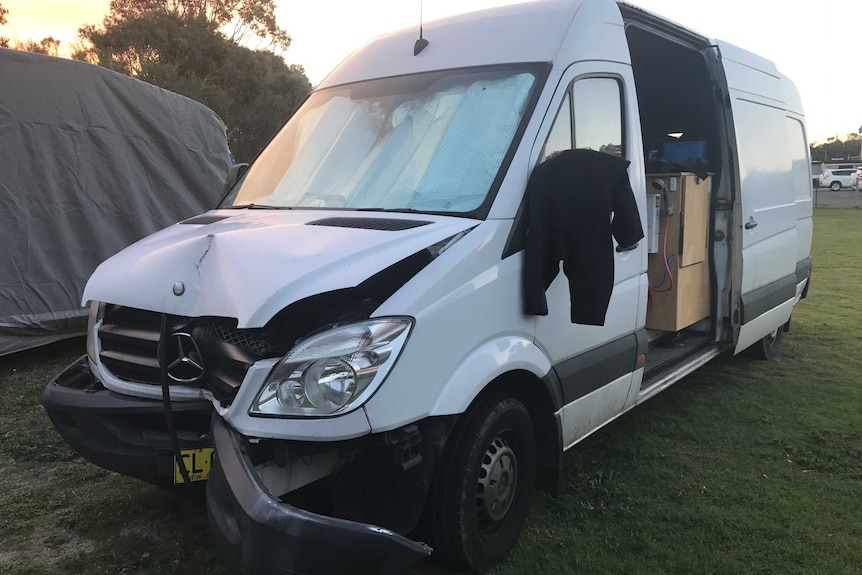 Jonny Dustow's white van with damage front and bumper bar after he drove into a pole