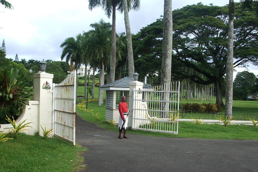 Guard standing at the entrance to the presidential palace in Suva.