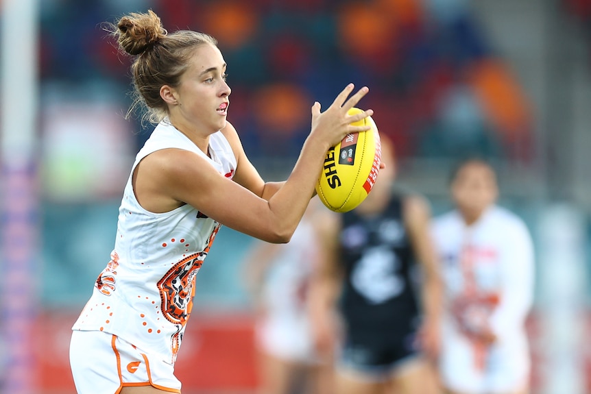 Georgia Garnett attemps to catch a ball.