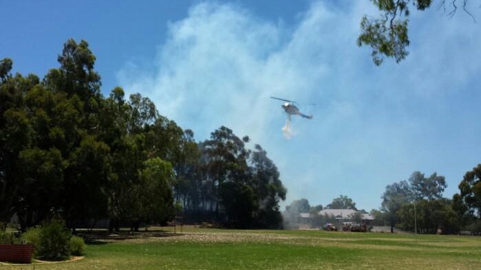 Helitac drops water over Coolbinia fire