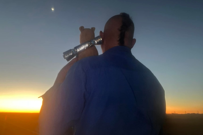 Mitch Rodgers and Pooh Bear watch a last sunset together