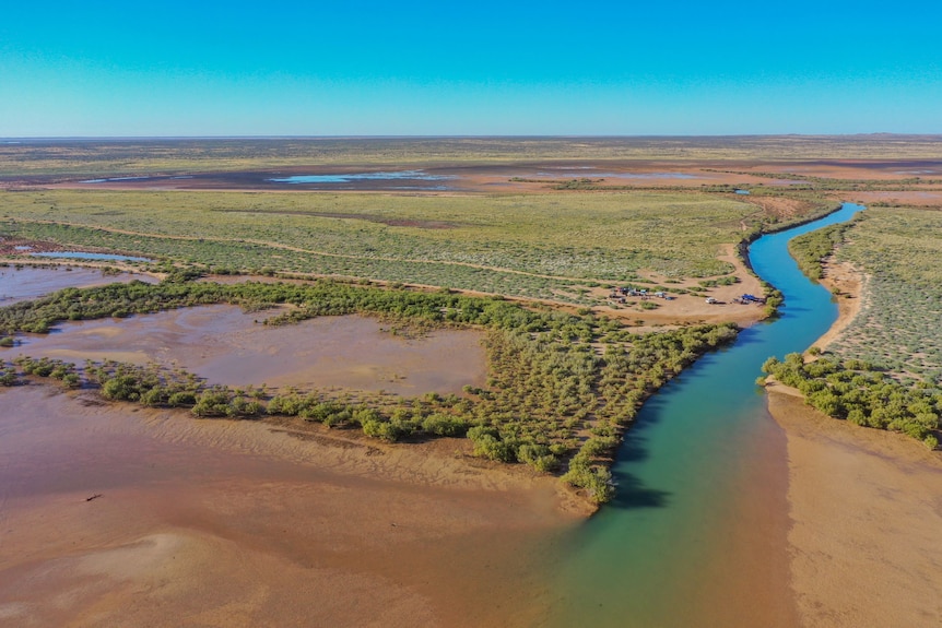 Aerial view of a waterway running into the sea at Exmouth Gulf.