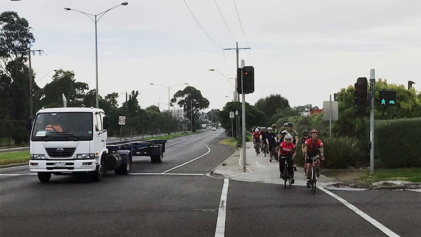 Cyclist use the bike lane where a woman was killed after being hit by a truck last night.