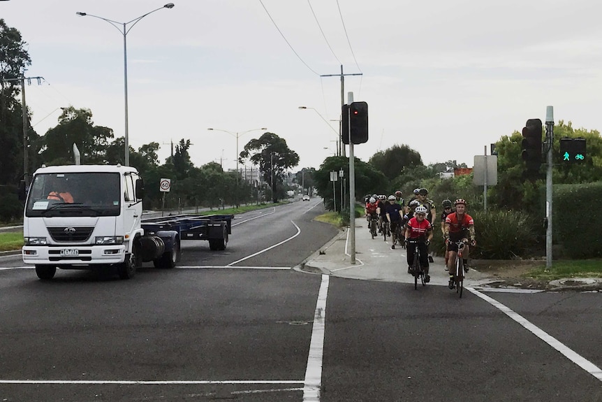 Cyclist use the bike lane where a woman was killed after being hit by a truck last night.