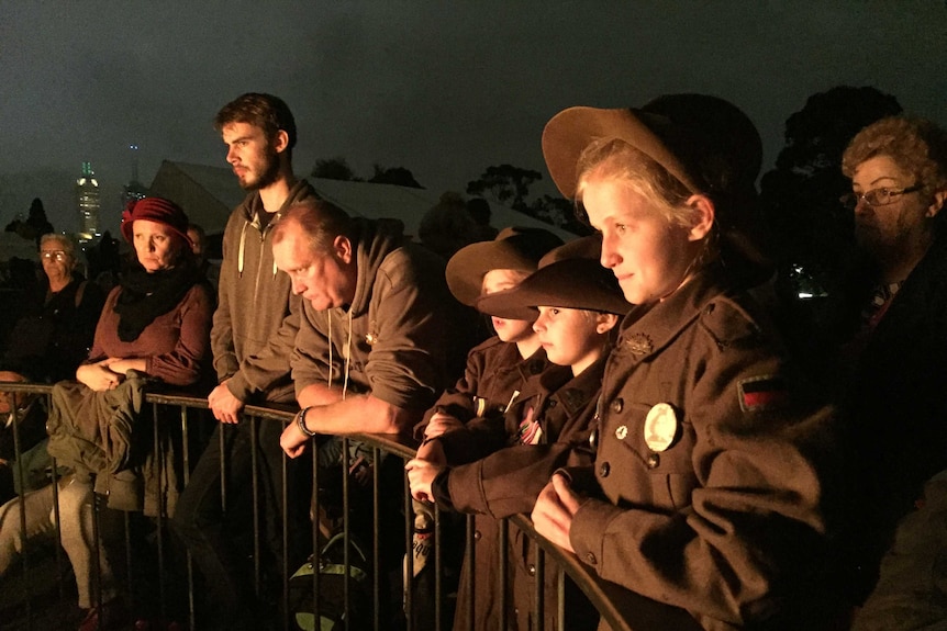 Children look at the eternal flame in Melbourne