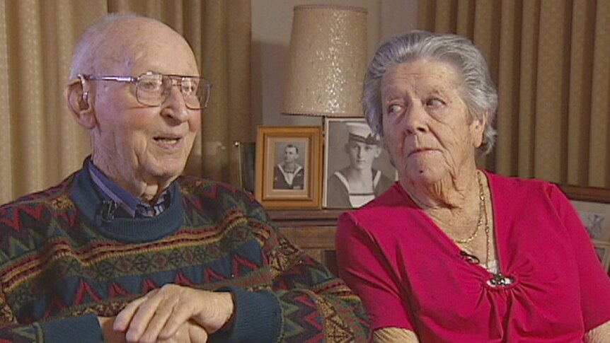 Sitting side by side are Vinnies volunteers Tom and Shirley Fisher at home in Perth