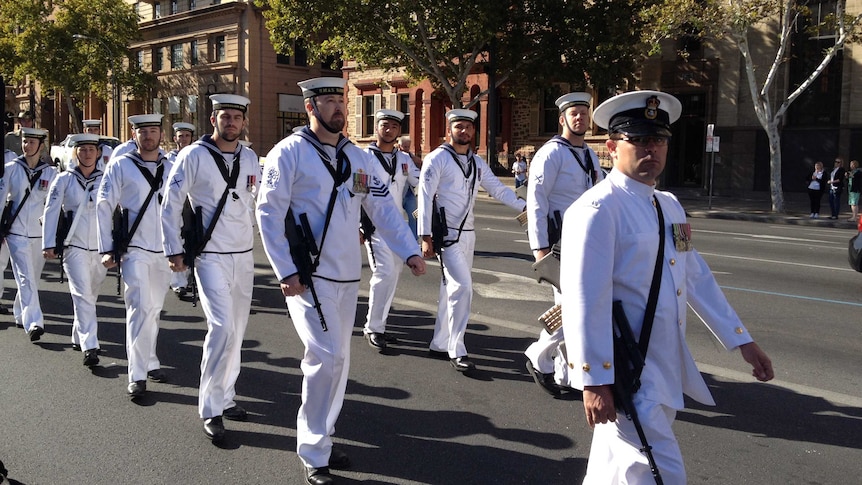 Defence personnel march in the Operation Slipper parade