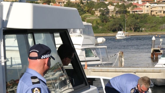 Water police boat with two officers on board