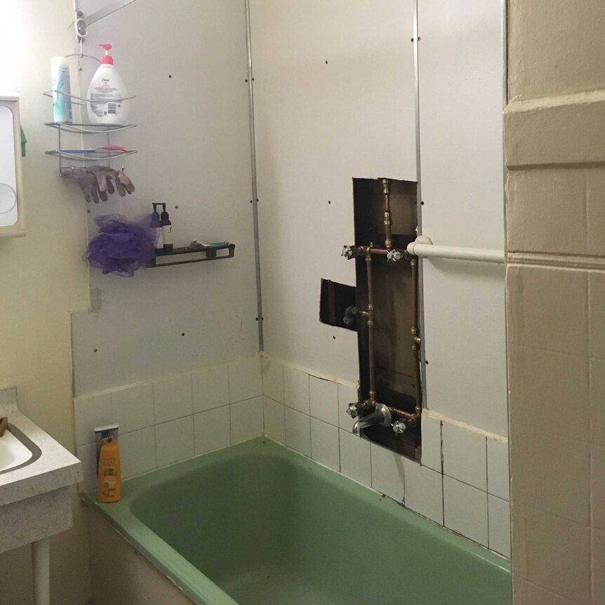 The hole in the bathroom wall at Ella Gleeson and Morgana Russell's Preston share house.