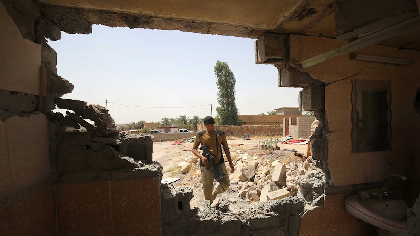 An Iraqi fighter in a town east of Fallujah