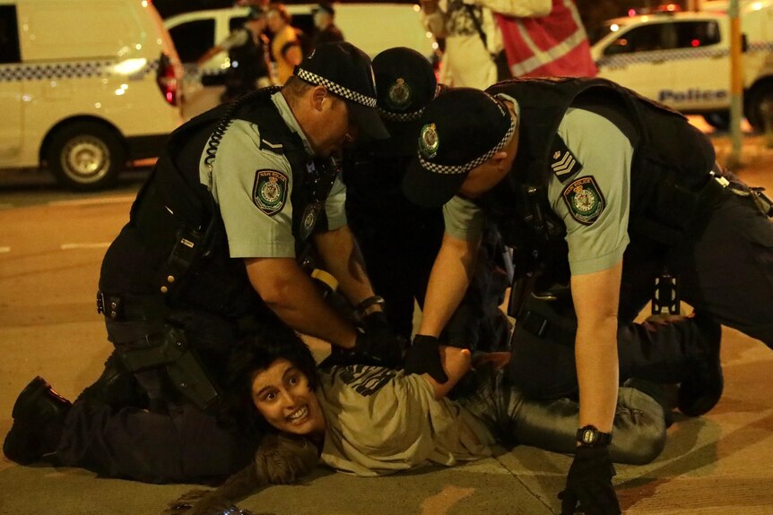 police pin down protester
