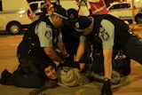 police pin down protester