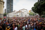 A photo showing crowds taking part in "Cordao do Boitata" block party during carnival festivities in Rio de Janeiro, 