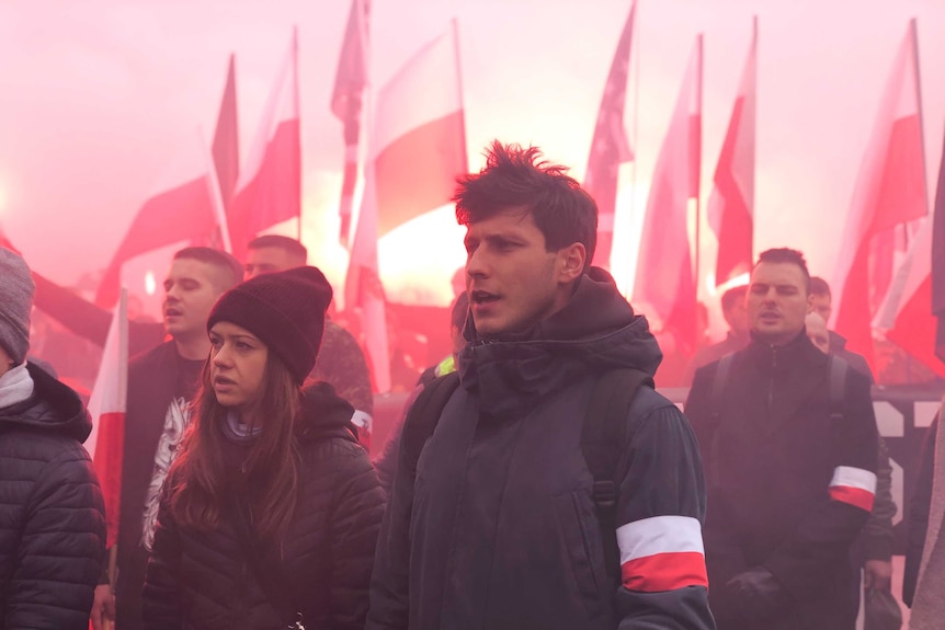 People marching with Polish flags