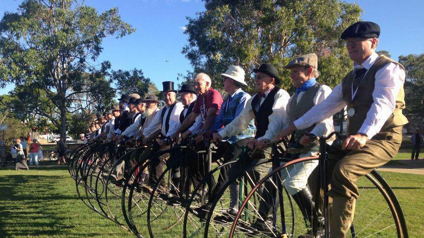 Brett Richardson and his group of Penny Farthings line up in Brisbane.