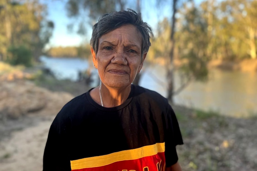 May Walker appears determined as she stands in front of the Murray River/Dhungala.