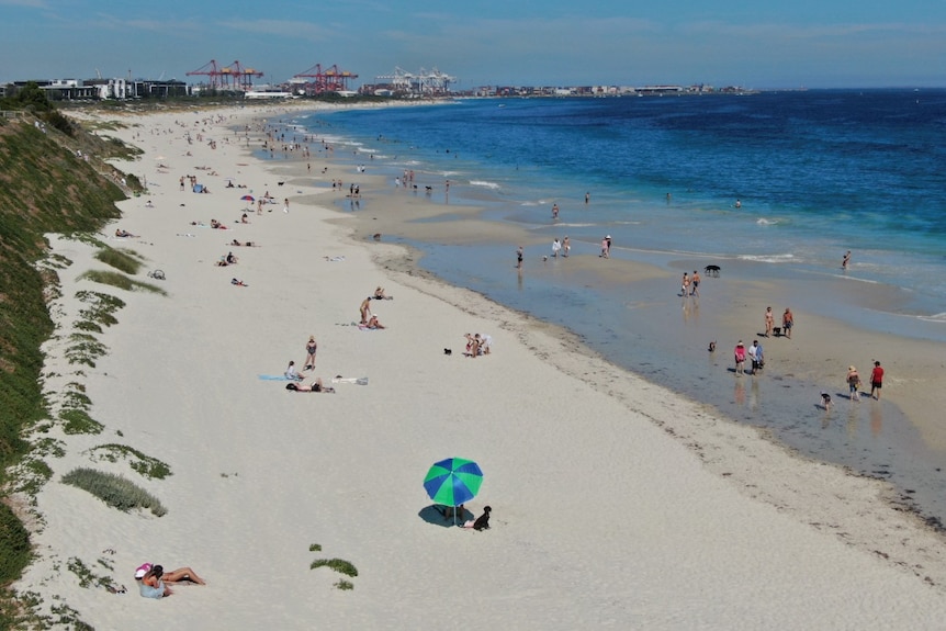 People on Leighton Beach in small groups on Good Friday.