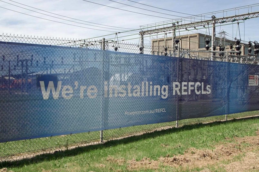 A sign says 'We're installing REFCLs'.
