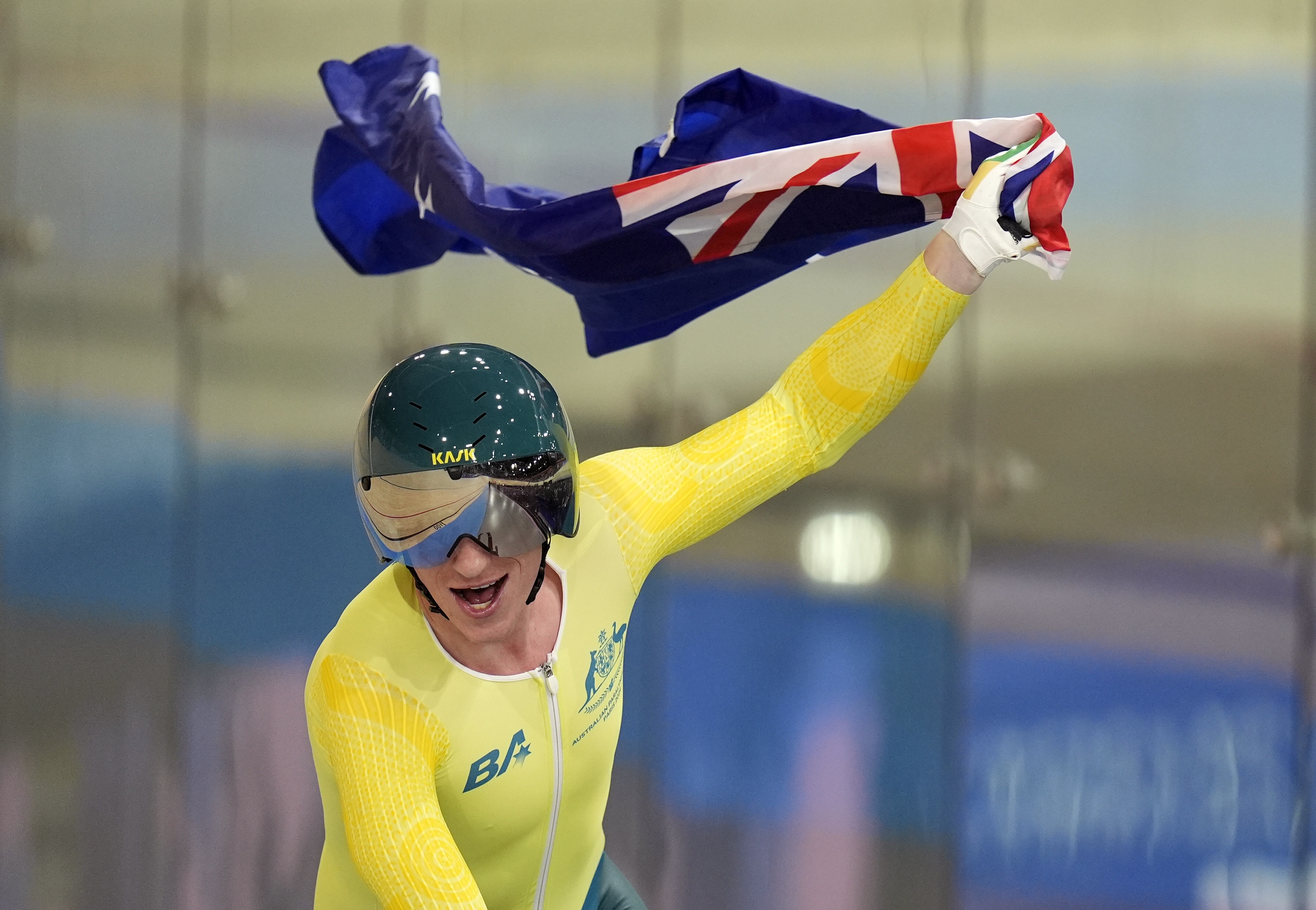 Korey Boddington holds up an Australian flag