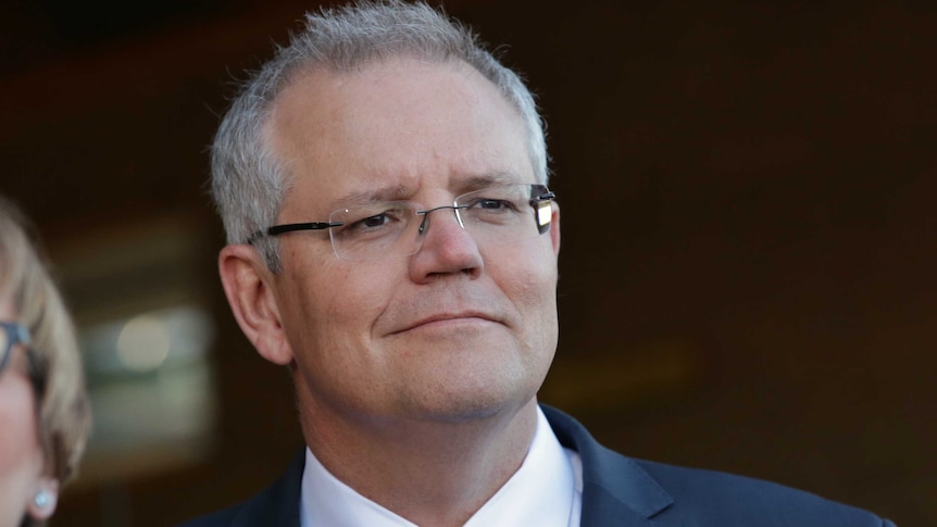 Close up of PM Scott Morrison with a smirk-like grin