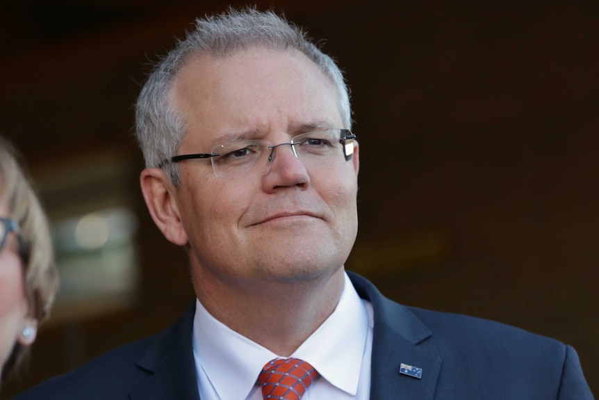 Close up of PM Scott Morrison with a smirk-like grin