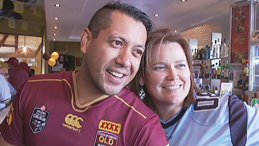 Robbie Crawford and Helen Baxter in rival Origin jerseys