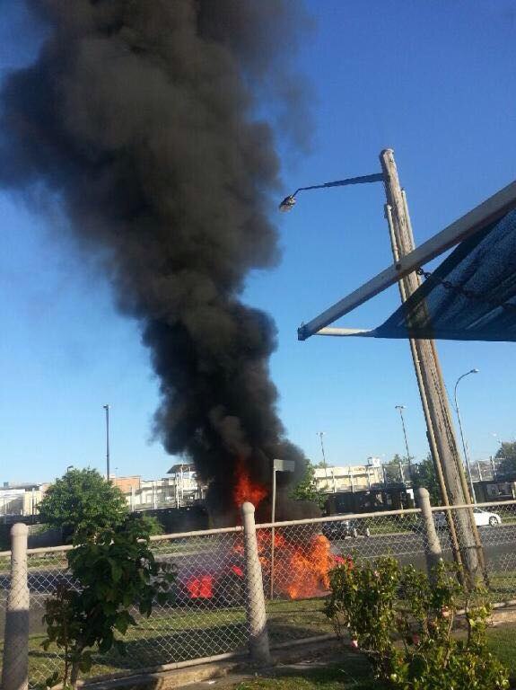 The Lotus sports car in flames outside Goulburn Police Station.