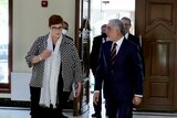 Marise Payne and Ashraf Ghani walking together. 