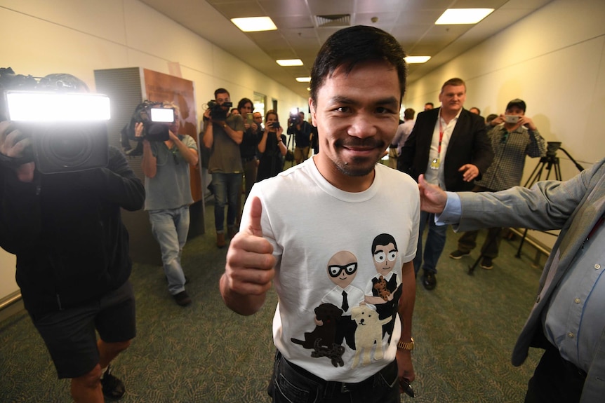 Filipino boxer Manny Pacquiao speaks to the media on arrival in Brisbane