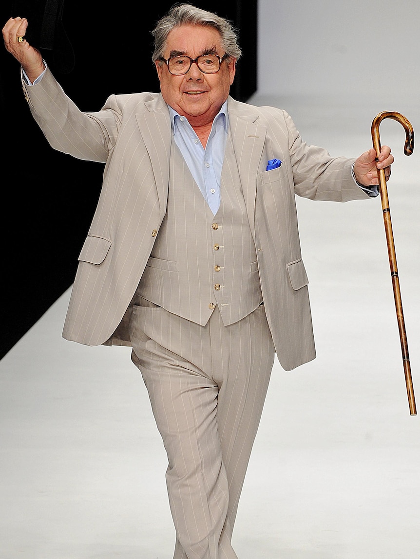 Ronnie Corbett walks down the catwalk during a fashion show in 2010.