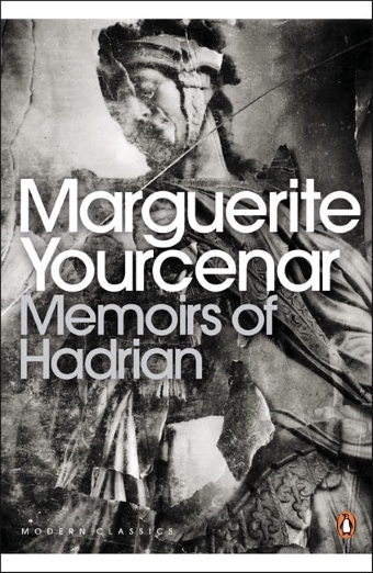 The book cover of Memoirs of Hadrian by Marguerite Yourcenar, black and white with a photo of an ancient sculpture
