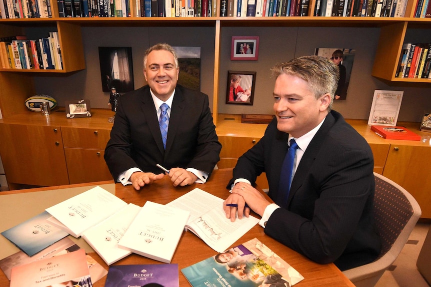 Ministers Joe Hockey and Mathias Cormann chat ahead of budget speech.