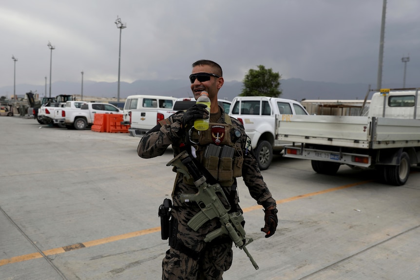 A member of the Afghan security forces stands guard at Bagram air base