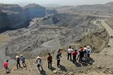 Onlookers observe a UN sanctioned mining site in Hpakant area of Kachin state, northern Myanmar