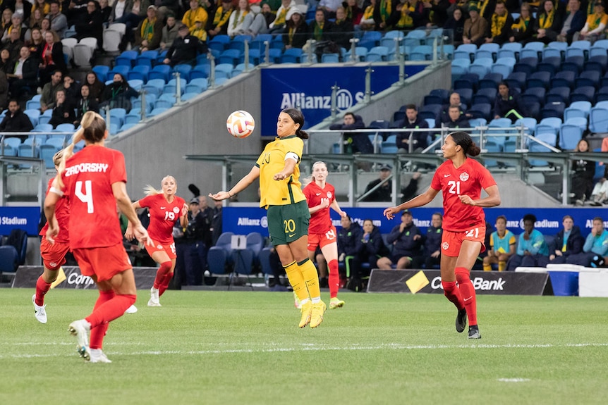 Sam Kerr finds space in a sea of defenders