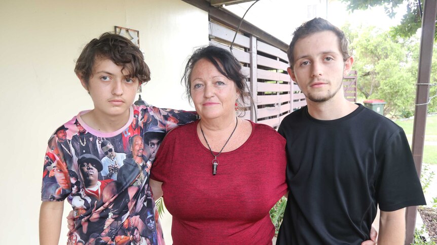 Two teenage boys and a woman