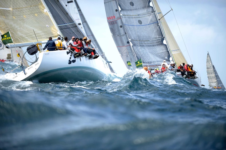 LtoR Zen and Wild Rose leave Sydney Harbour after the start to the Sydney to Hobart yacht race.