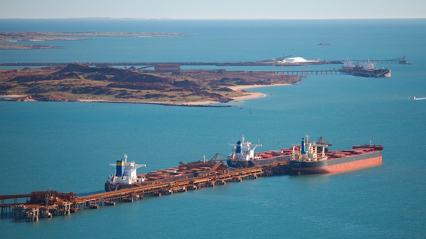 Aerial view of Dampier Port with bulk carriers alongside berth.