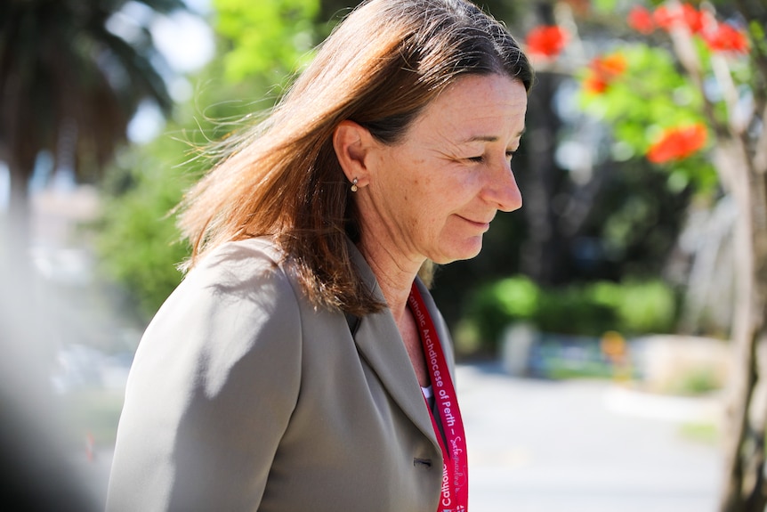 A head and shoulder shot of Barbara Blayney walking to the inquiry.