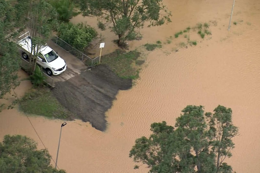 Car trapped in floodwaters