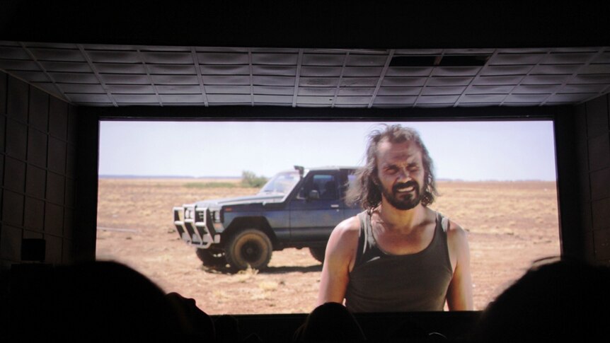 Actor Aaron Pedersen on screen in Goldstone, with the western Queensland landscape as his backdrop.