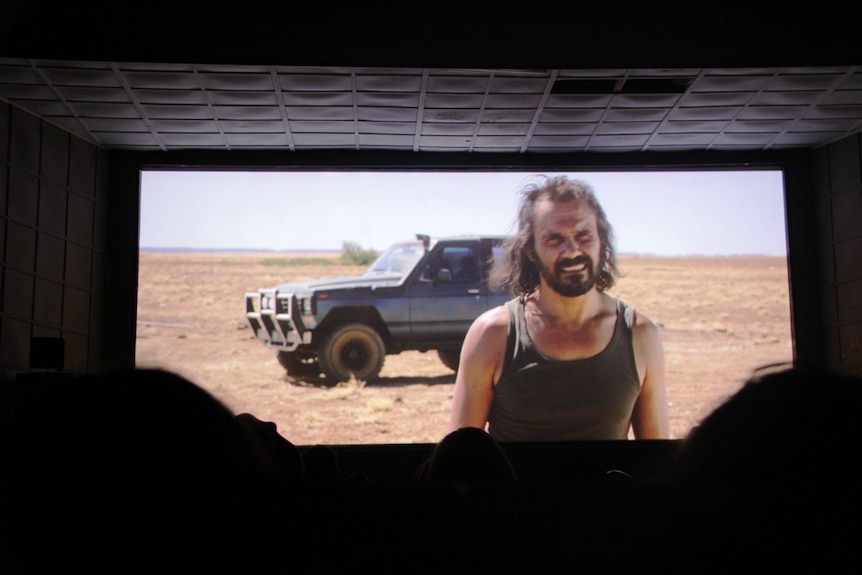 Actor Aaron Pedersen on screen in Goldstone, with the western Queensland landscape as his backdrop.