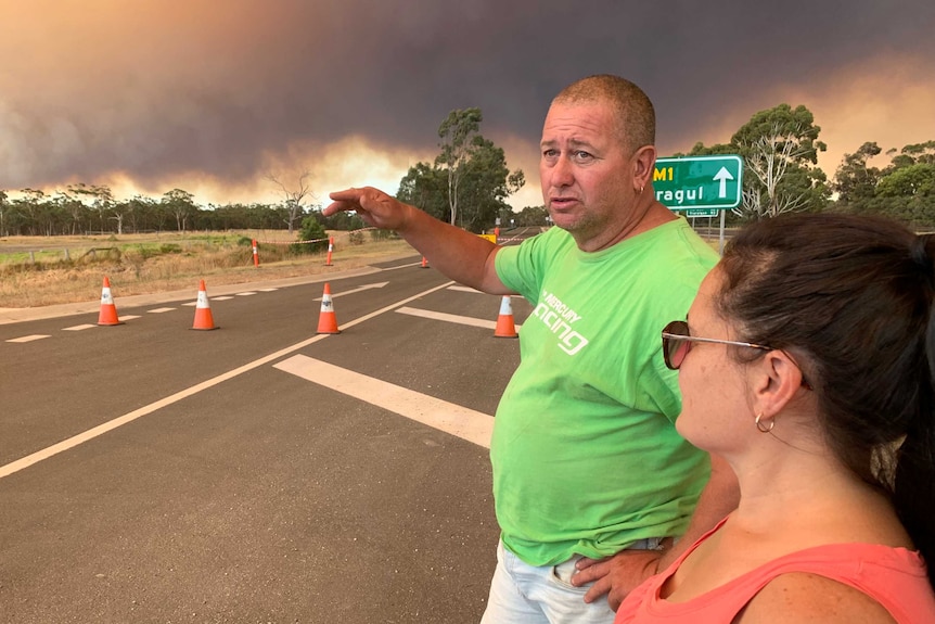 Zol Gyore standing beside the Princes Freeway with smoke in the background.