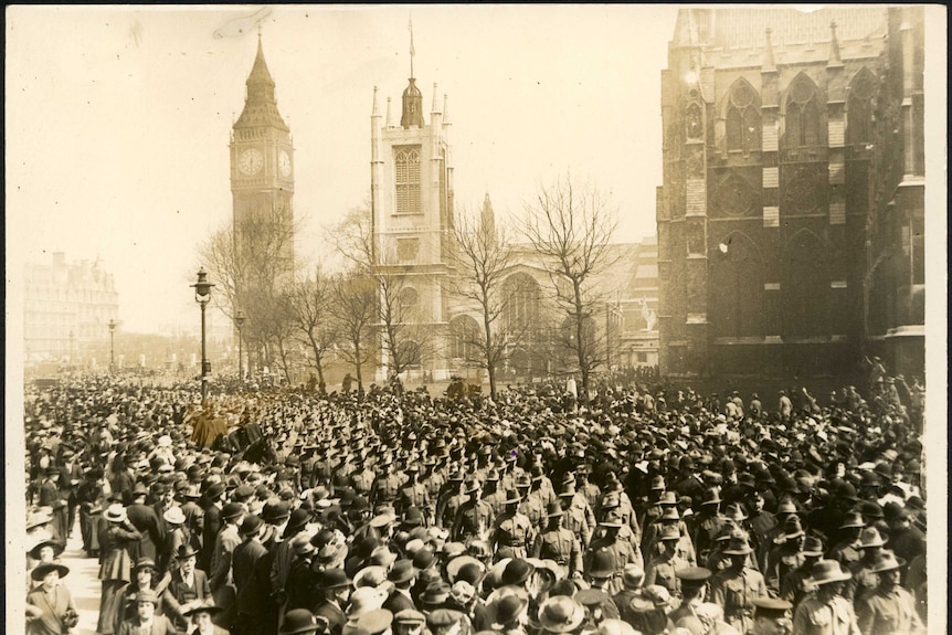 Troops march by Westminster Abbey and Big Ben in 1916.
