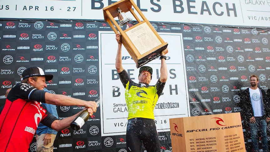 Mick Fanning celebrates winning the Bells Beach title.jpg