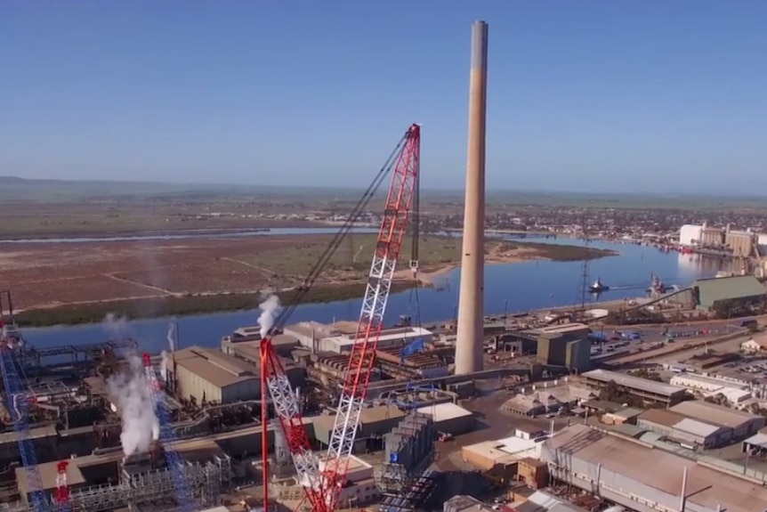 Smelter viewed from air with river in background.